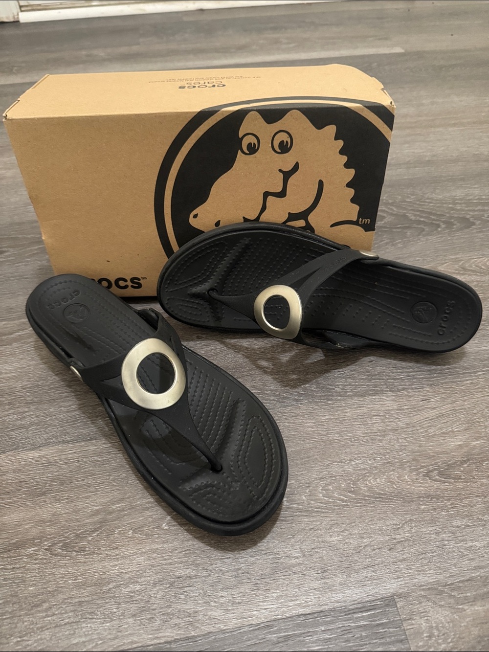 CROCS Black Flip Sandals with Silver Ring Detail